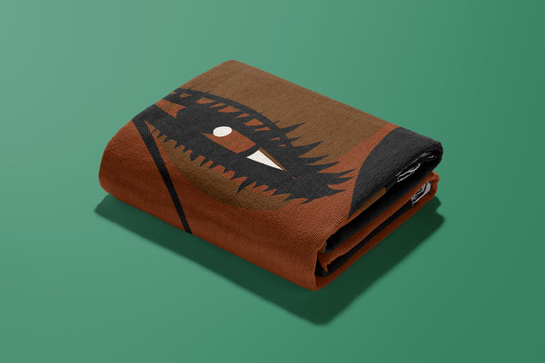 About Face Throw  folded up showing the dark painted lips