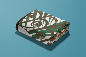 Self-Care Sunday Throw folded up on a turquoise background