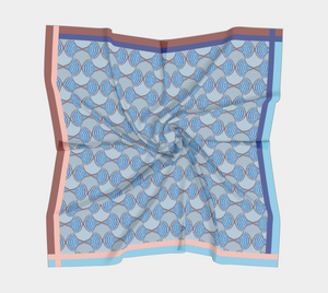 Silk charmeuse scarf with pink blue geometric pattern slightly scrunched up 